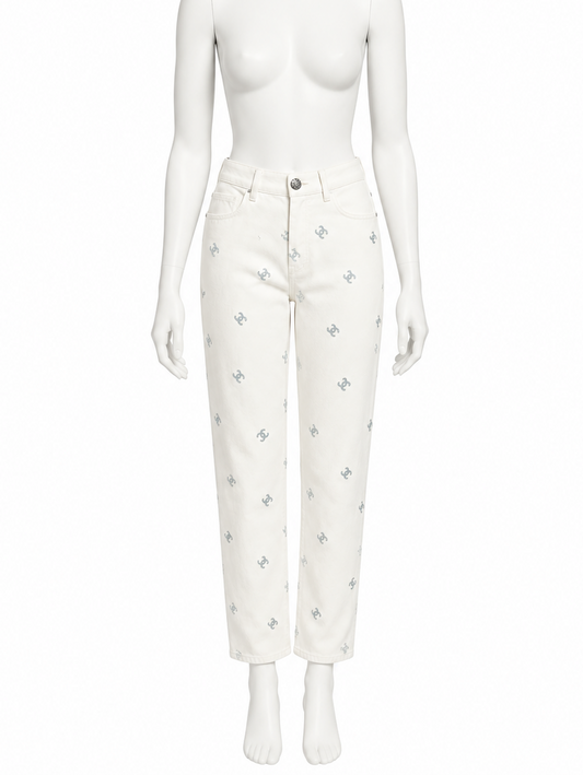 Chanel ivory embroidered CC jeans slimmer shorter fit on white mannequin